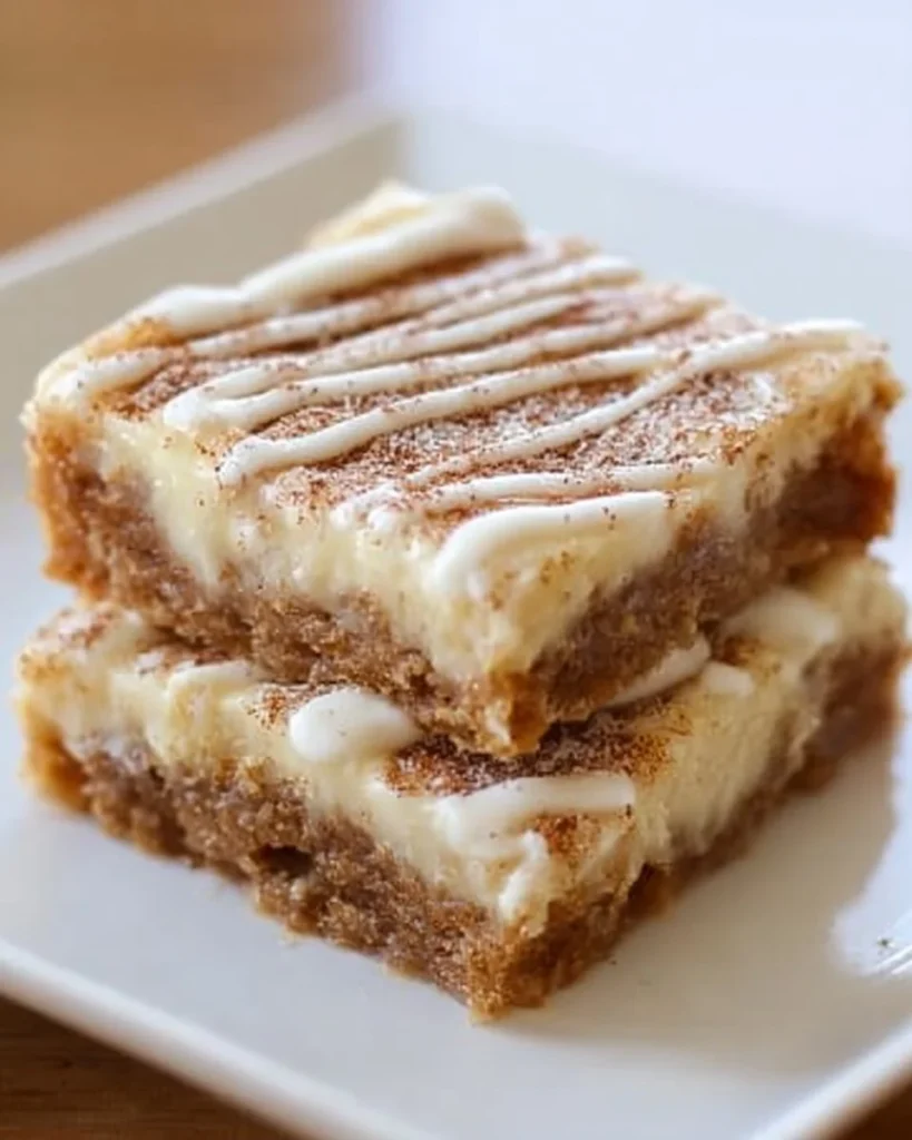 Delicious homemade cinnamon cream cheese bars with a creamy topping